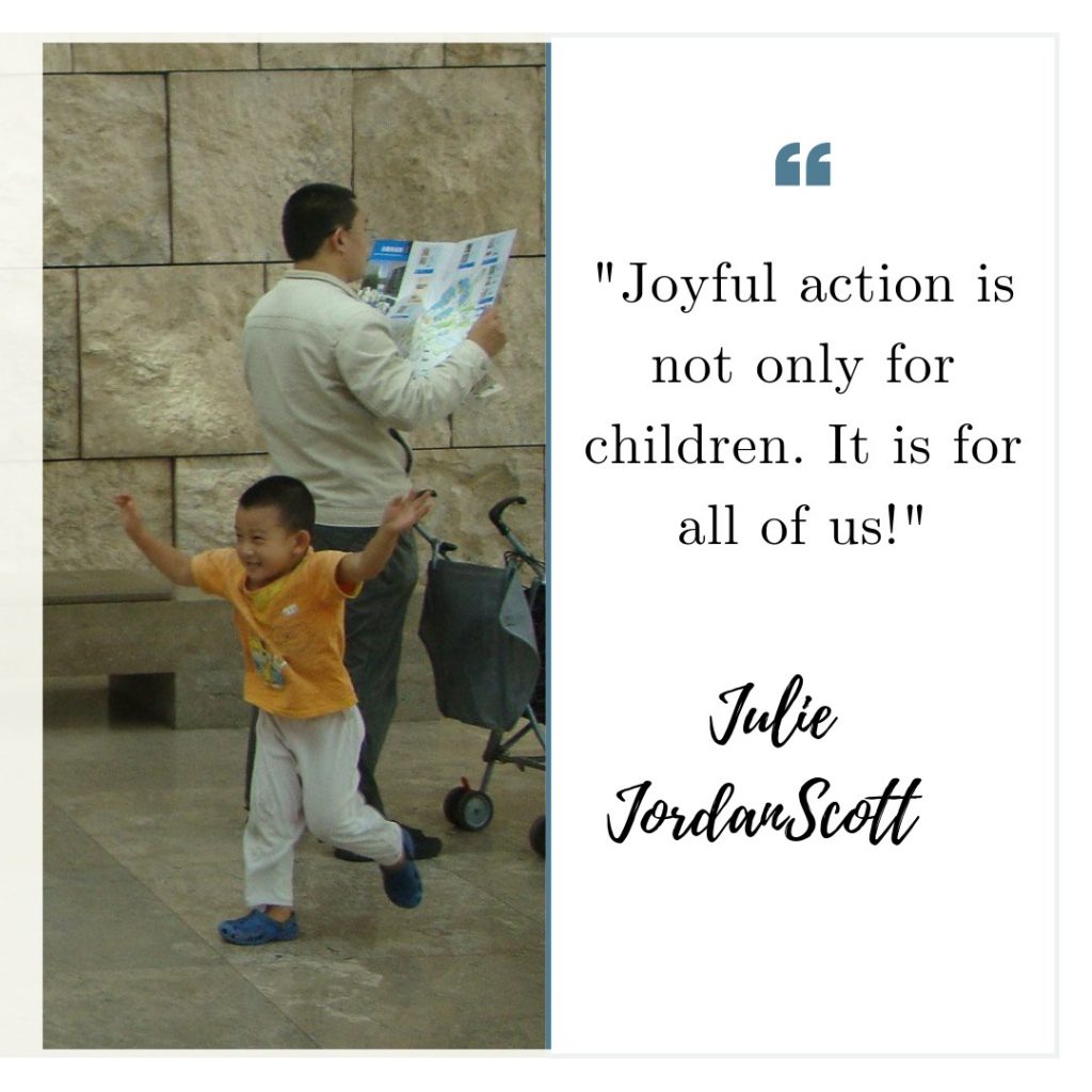 Little boy taking joyful action at the Getty Museum in Los Angeles