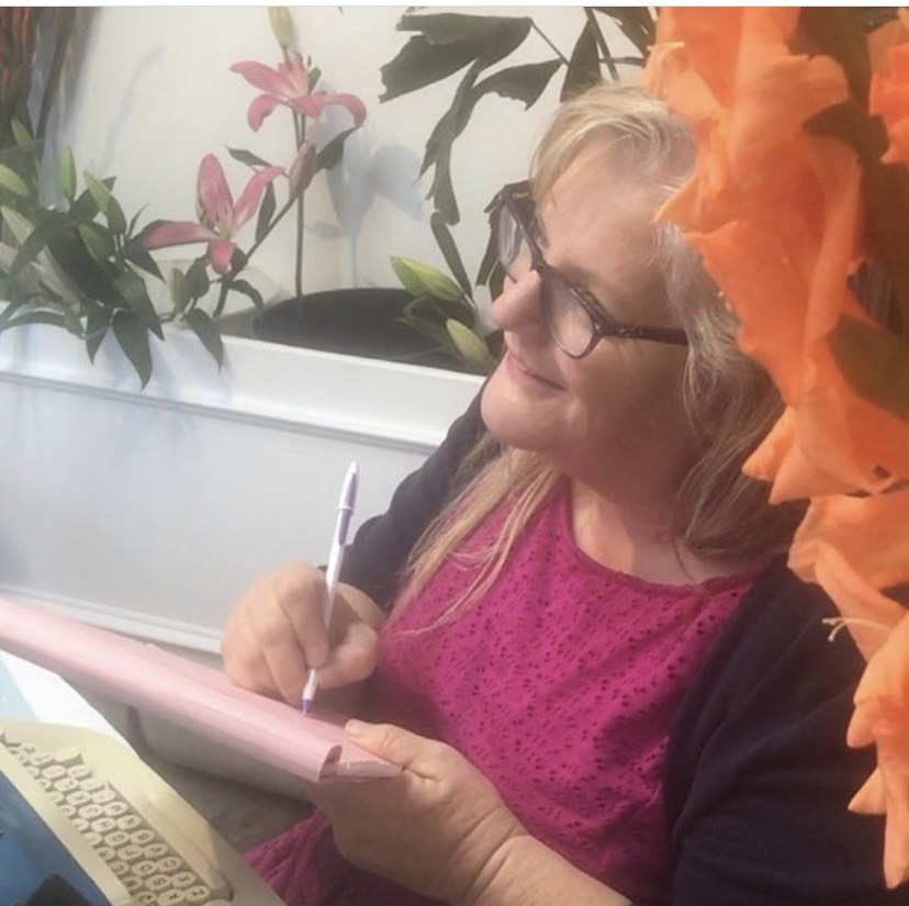 Julie JordanScott writing poetry at a downtown Bakersfield flower shop.