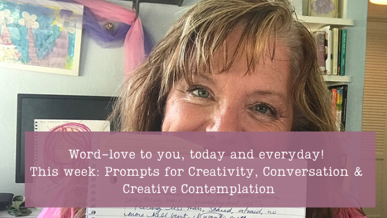 Julie JordanScott, the Creative Life Midwife, is in her Bakersfield, California living room wishing you word-love. She invites you to participate in this week of creative writing and joy. A full book shelf is behind her and she holds a notebook in her hands.