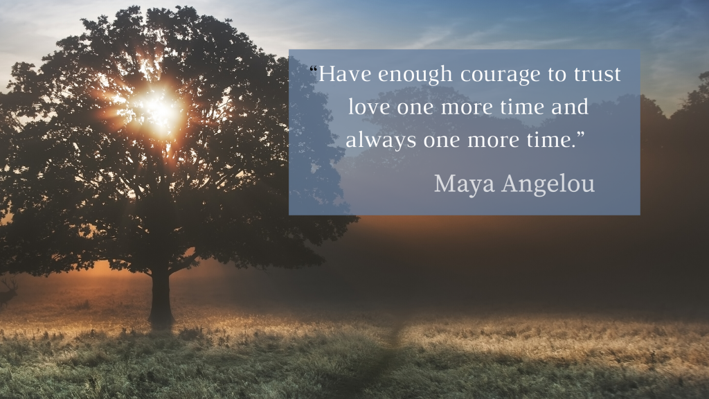 Light through a  tree at sunrise with the Maya Angelou quote, "Have enough courage to trust love one more time and always one more time."