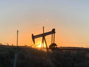 A pumpjack (oil well) in North Bakersfield at sunrise.