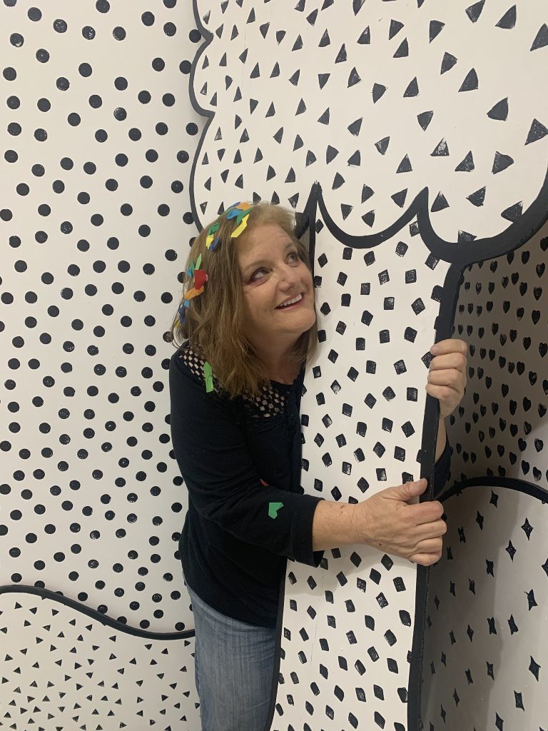 Hugging a cartoon tree is almost as fun as hugging a tree outside, almost. Creator of #377TreeHugs, Julie Jordan Scott, enjoys hugging a black and white cartoon tree in downtown Bakersfield.