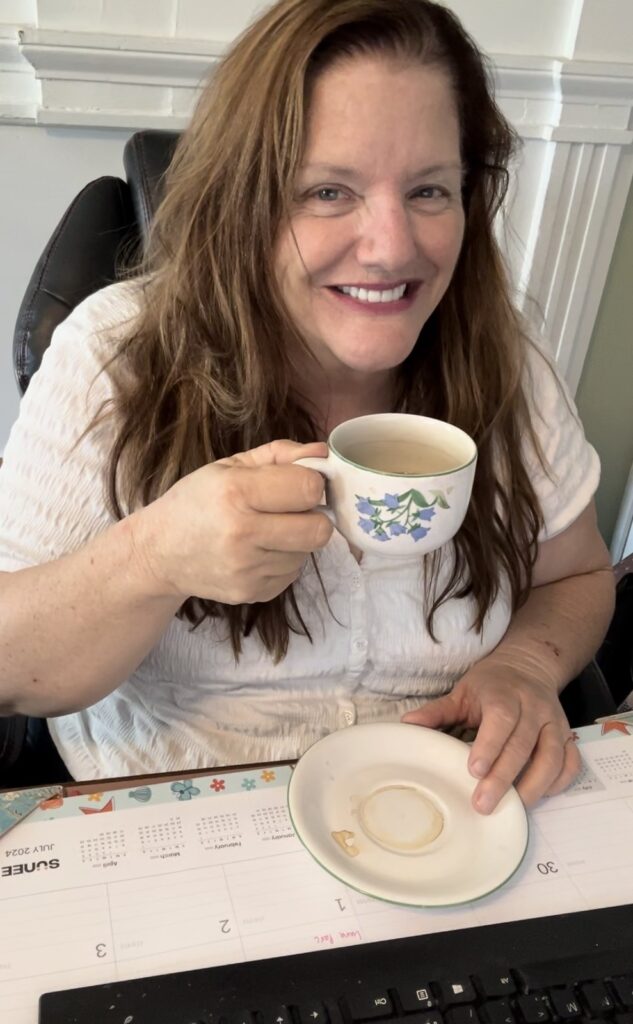 Julie Jordan Scott is a writer, creativity coach and creative entrepreneur. She enjoys drinking coffee at her desk as she expands her entrepreneurial circle.